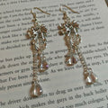 bow iridescent teardrop earrings